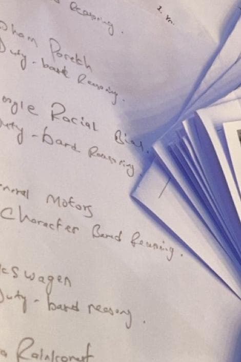 Handwritten notes listing real-world ethics cases, each paired with the kind of reasoning it draws on, beside a fanned deck of printed case cards