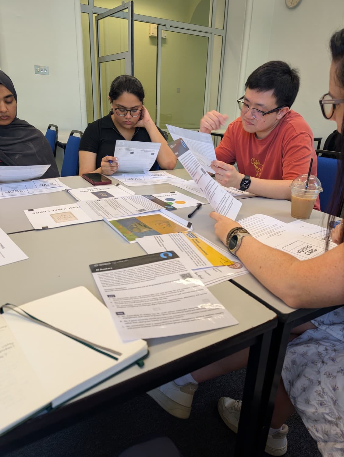 Close-up of case cards and voting cards during the student ambassadors' discussion